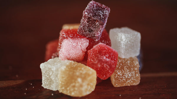 berry sweets collection image with piled up sweets on a wooden table