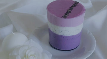 three-layered blueberry chia pudding in a glass on a plate