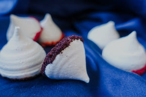 Harctic Superfoods True Arctic Superfoods delicious meringues with dark chocolate and berry powder piled on a plate