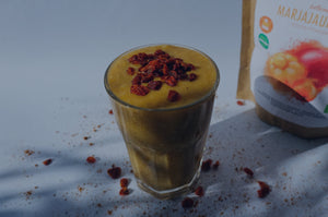 vitamin c rich super smoothie with sea buckthorn and rosehip in a glass