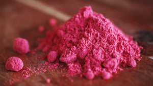 berry powder collection image with organic lingonberry powder on a wooden table